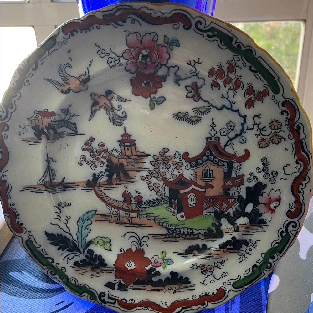 Decorative Asian-Inspired Plate with Floral and Scenic Design